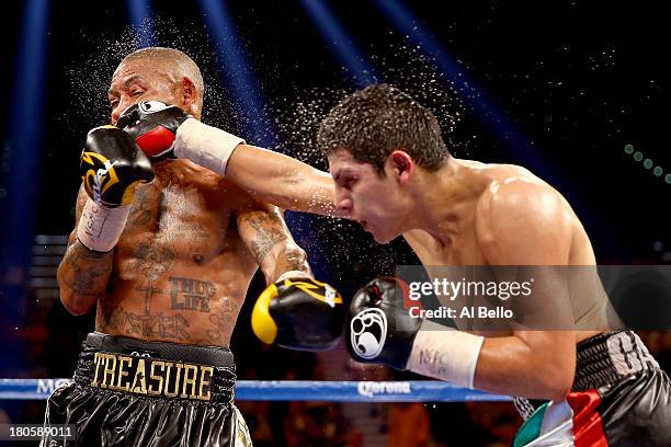 Pablo Cesar Cano throws a right to the head of Ashley Theophane during their welterweight fight at the MGM Grand Garden Arena on September 14, 2013...