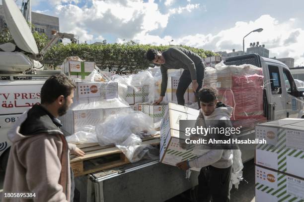 An aid truck carrying medicine and medical supplies for Nasser Medical Hospital is unloaded having entered through the Rafah crossing on November 21,...