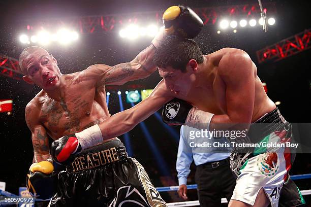 Pablo Cesar Cano throws a right to the body of Ashley Theophane during their welterweight fight at the MGM Grand Garden Arena on September 14, 2013...
