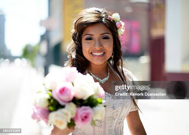 Emily Desiree Mendez celebrates her quinceanera before taking part in the third annual Grand Marian European-style procession from La Placita to the...