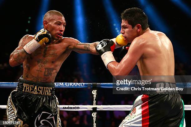Ashley Theophane throws a left to the head of Pablo Cesar Cano during their welterweight fight at the MGM Grand Garden Arena on September 14, 2013 in...