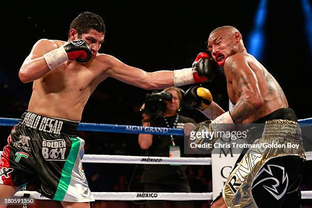 Pablo Cesar Cano lands a left to the face of Ashley Theophane during their welterweight fight at the MGM Grand Garden Arena on September 14, 2013 in...