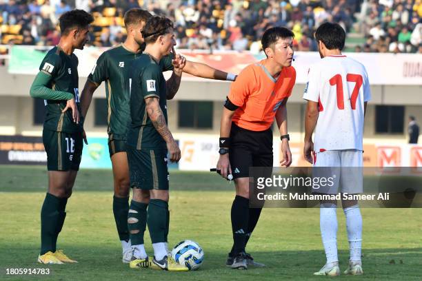 Match referee gives warning to Ehson Panshanbe from Tajikistan during the 2026 FIFA World Cup AFC Qualifier Group G match between Pakistan and...