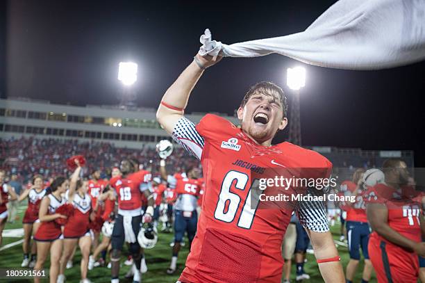 Long snapper Austin Cole of the South Alabama Jaguars celebrates after defeating the Western Kentucky Hilltoppers on September 14, 2013 at...