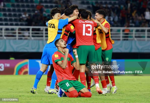 Players of Morocco celebrate after Nassim Azaouzi of Morocco scored the team's first goal during the FIFA U-17 World Cup Round of 16 match between...