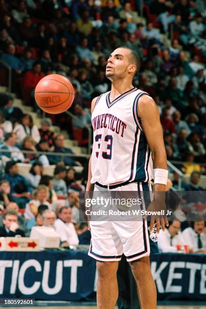 University of Connecticut basketball player Donny Marshall shoots a free throw at the foul line during a game, Storrs, Connecticut, 1994.