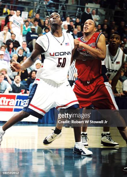 University of Connecticut basketball player Emeka Okafor battles for a rebounds, Storrs, Connecticut, 2000.