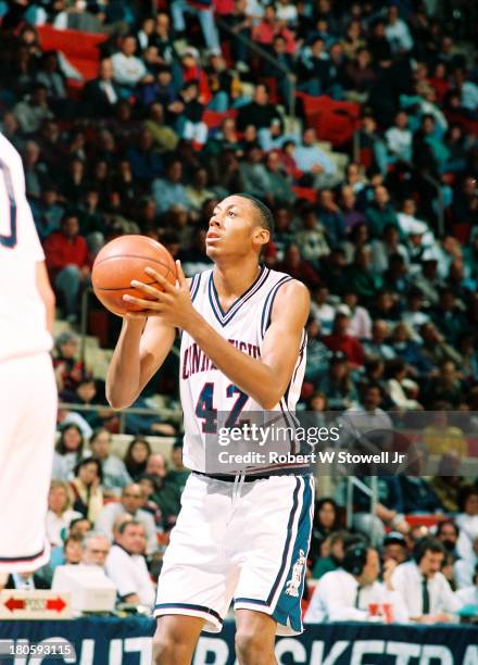 University of Connecticut basketball player Donyell Marshall shoots a free throw at the foul line during a game, Storrs, Connecticut, 1994.