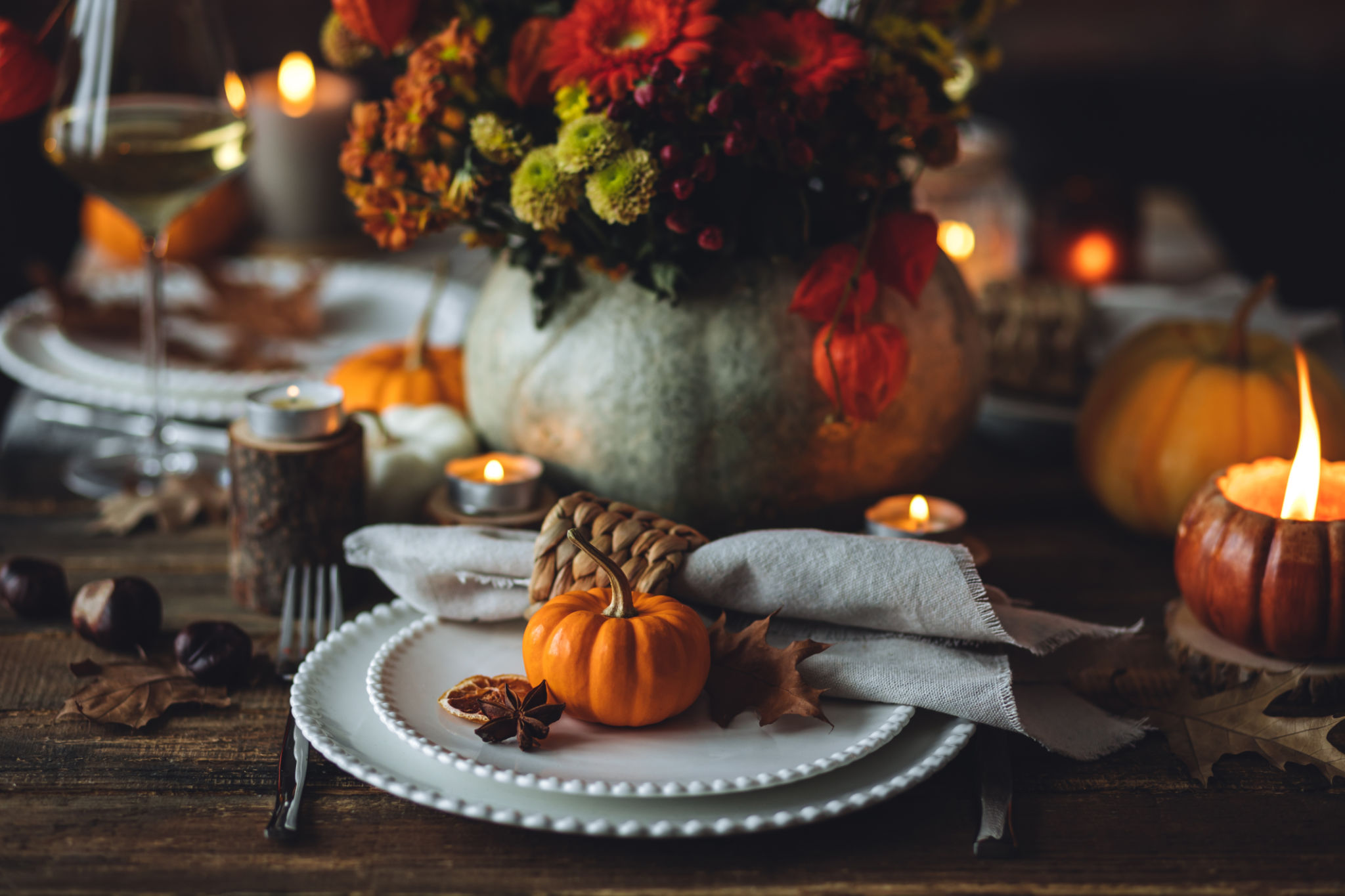 Fall table decoration with pumpkins, wine. Family cozy thanksgiving dinner arrangement indoors at home, wedding elegant decor. Countryside style, simple handmade setting, autumn mood, inspiration. Fall table decoration with pumpkins, wine. Family cozy thanksgiving dinner arrangement indoors at home, wedding elegant decor. Countryside style, simple handmade setting, autumn mood, inspiration.