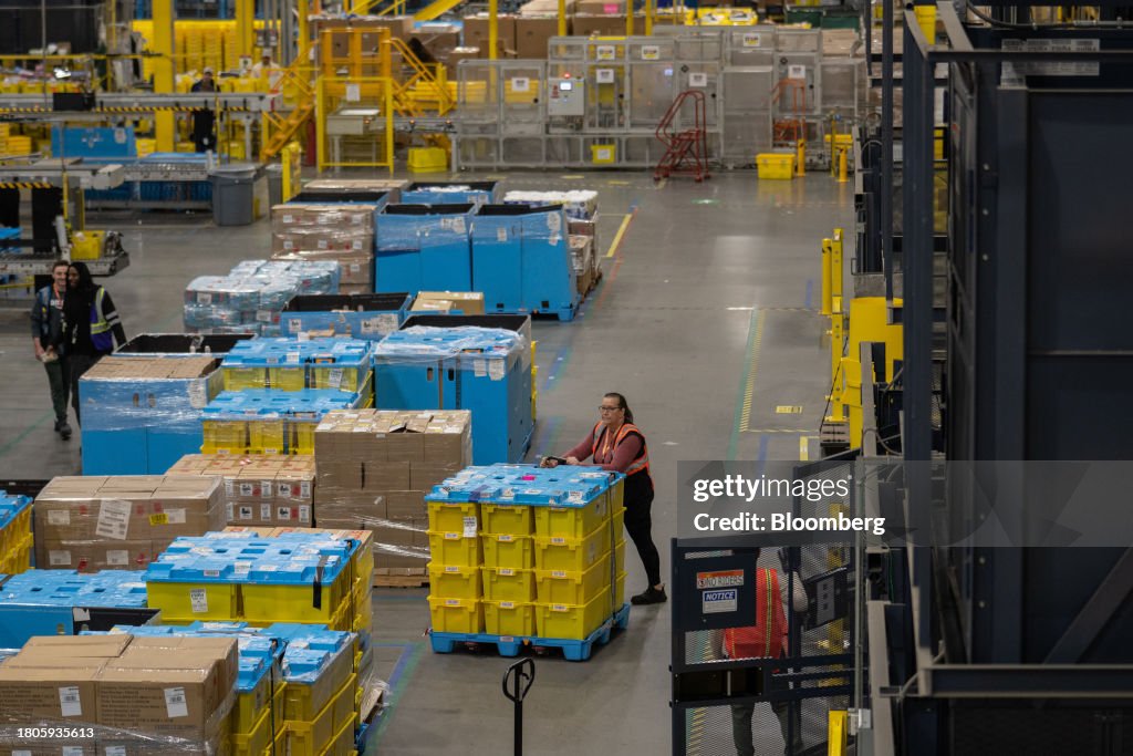 Amazon Parcel In Center Workers prepare packages for shipping at an Amazon Fulfillment center ...