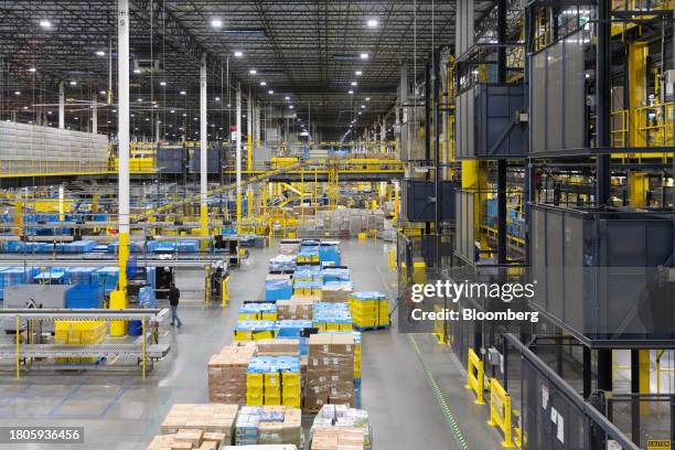 Workers prepare packages for shipping at an Amazon Fulfillment center on Cyber Monday in Robbinsville, New Jersey, US, on Monday, Nov. 27, 2023. An...