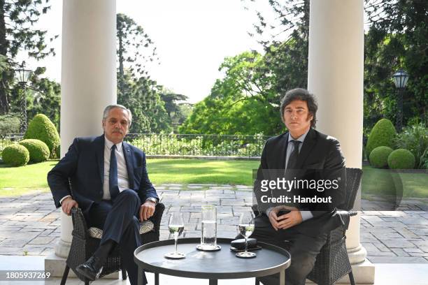 President of Argentina Alberto Fernandez and president-elect Javier Milei pose for a picture during a meeting at the Olivos government's residence on...