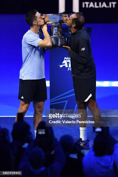 Rajeev Ram of United States and Joe Salisbury of Great Britain kiss the Nitto ATP Men's Doubles Trophy following their victory in the Men's Doubles...