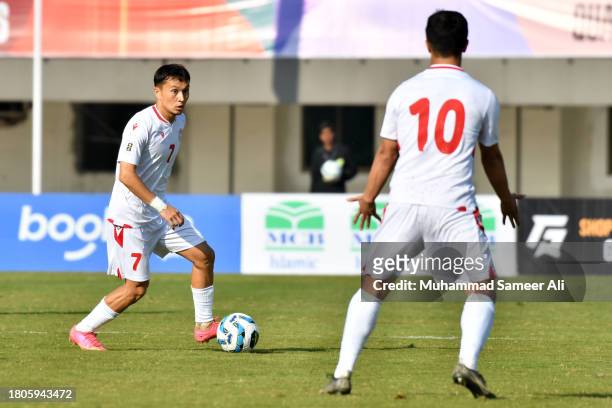 Dzhalilov Alisher of Tajikistan signals to Umarboev Parvizjon of Tajikistan to get the pass during the 2026 FIFA World Cup AFC Qualifier Group G...