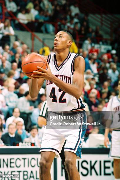 University of Connecticut basketball player Donyell Marshall shoots a free throw at the foul line during a game, Storrs, Connecticut, 1994.