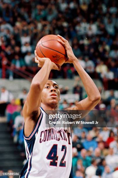 University of Connecticut basketball player Donyell Marshall shoots a free throw at the foul line during a game, Storrs, Connecticut, 1994.