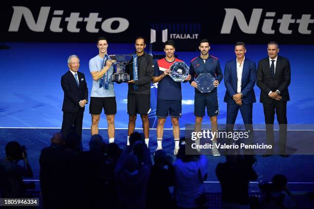 Rajeev Ram of United States and Joe Salisbury of Great Britain lift the Nitto ATP Men's Doubles Trophy following their victory in the Men's Doubles...