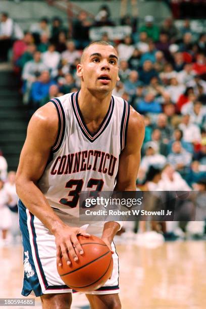 University of Connecticut basketball player Donyell Marshall shoots a free throw at the foul line during a game, Storrs, Connecticut, 1994.