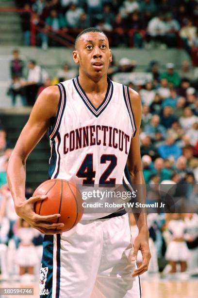 University of Connecticut basketball player Donyell Marshall shoots a free throw at the foul line during a game, Storrs, Connecticut, 1994.