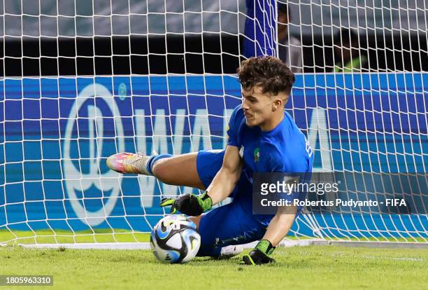Taha Benrhozil of Morocco saves a penalty in the penalty shootout during the FIFA U-17 World Cup Round of 16 match between Morocco and IR Iran at...