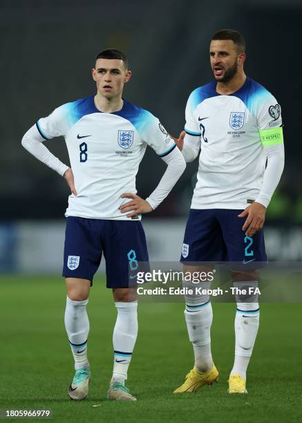 Phil Foden and Kyle Walker of England speak during the UEFA EURO 2024 European qualifier match between North Macedonia and England at National Arena...