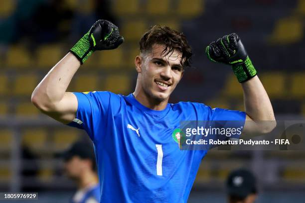 Taha Benrhozil of Morocco celebrates after saving a penalty in the penalty shootout during the FIFA U-17 World Cup Round of 16 match between Morocco...