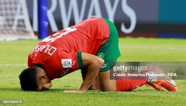 Saifdine Chlaghmo of Morocco celebrates following the team's victory in the penalty shootout during the FIFA U-17 World Cup Round of 16 match between...
