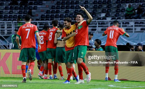 Players of Morocco celebrate after their victory after the penalty shootout in the FIFA U-17 World Cup Round of 16 match between Morocco and IR Iran...