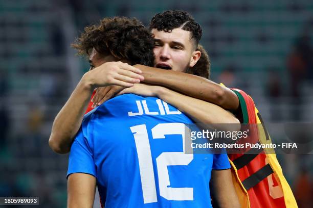 Hamza Jlid of Morocco celebrate with teammates after winning the penalty shootout in the FIFA U-17 World Cup Round of 16 match between Morocco and IR...