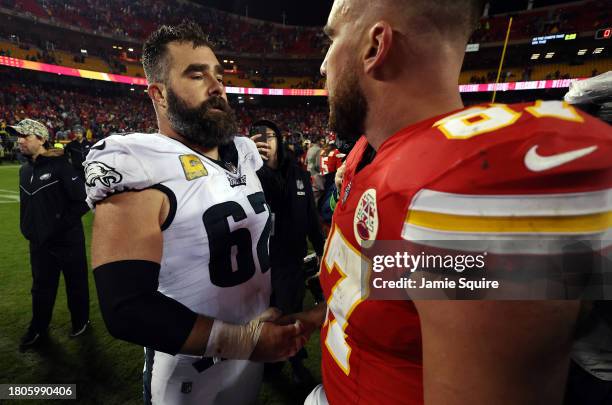 Jason Kelce of the Philadelphia Eagles and brother Travis Kelce of the Kansas City Chiefs greet each other at midfield after their game at GEHA Field...