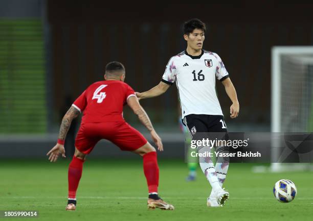 Takehiro Tomiyasu of Japan makes a pass during the FIFA World Cup Asian 2nd qualifier match between Syria and Japan at Prince Abdullah Al Faisal...