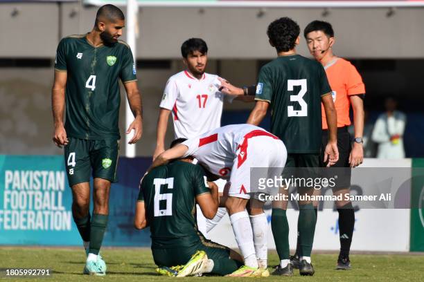 Rustam Soirov of Tajikistan checks Mamoon Moosa Khan of Pakistan during the 2026 FIFA World Cup AFC Qualifier Group G match between Pakistan and...