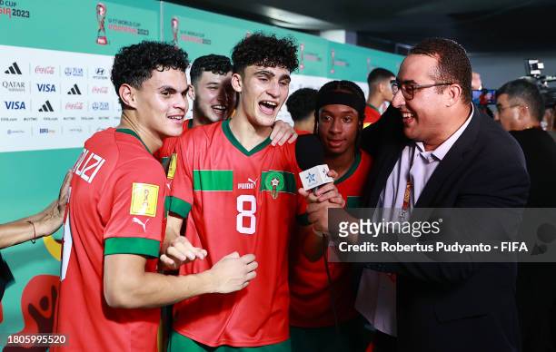 Adam Boufandar of Morocco celebrates as he speaks to the media after the FIFA U-17 World Cup Round of 16 match between Morocco and IR Iran at Gelora...