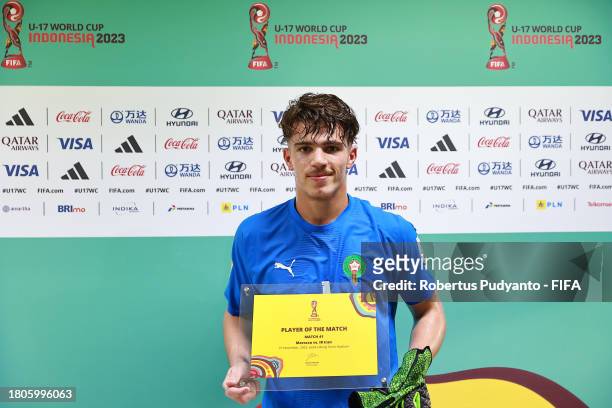 Taha Benrhozil of Morocco poses for a photograph with his Player of the Match award after the FIFA U-17 World Cup Round of 16 match between Morocco...
