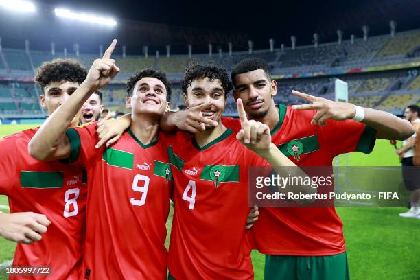 Adam Boufandar, Nassim Azaouzi, Ayoub Chaikhoun and Zakaria Quazane of Morocco celebrate after the FIFA U-17 World Cup Round of 16 match between...