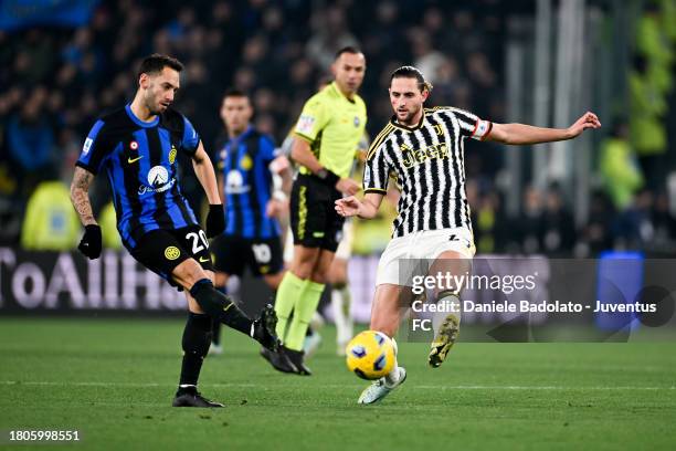 Adrien Rabiot of Juventus and Hakan Calhanoglu of Inter during the Serie A TIM match between Juventus and FC Internazionale at Allianz Stadium on...