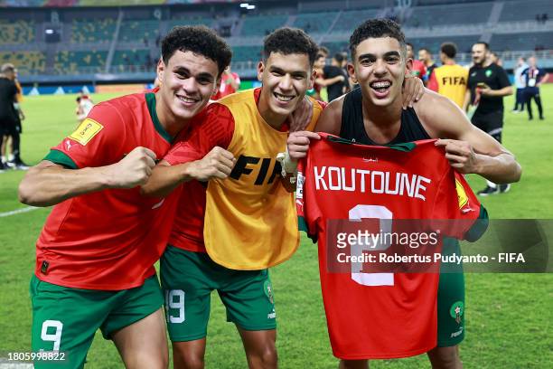 Nassim Azaouzi, Smail Bakhty and Hamza Koutoune of Morocco celebrate after the FIFA U-17 World Cup Round of 16 match between Morocco and IR Iran at...