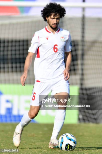 Vahdat Hanonov from Tajikistan with the ball during the 2026 FIFA World Cup AFC Qualifier Group G match between Pakistan and Tajikistan at Jinnah...