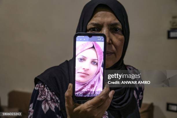 Fatima al-Ashwah, a 61-year-old Palestinian refugee living at the Burj al-Barajneh Palestinian refugee camp in Beirut's southern suburbs, shows on...