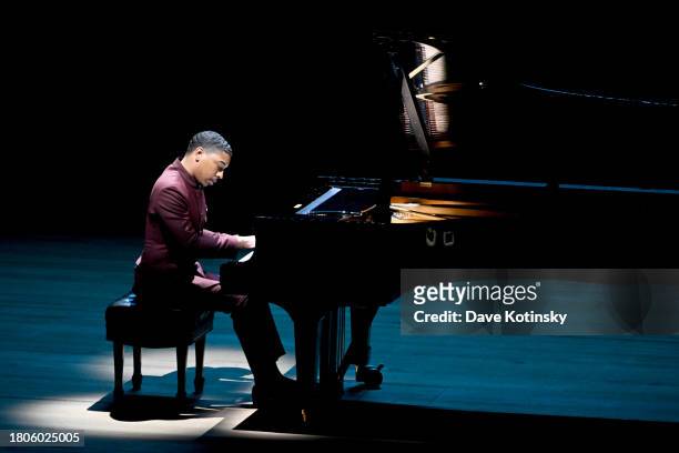 Christian Sands performs onstage at Lincoln Center's Fall Gala honoring James G. Dinan at David Geffen Hall on November 20, 2023 in New York City.