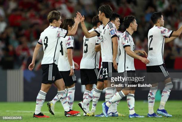 Ayase Ueda of Japan celebrates with team mates after scoring the team's third goal during the FIFA World Cup Asian 2nd qualifier match between Syria...