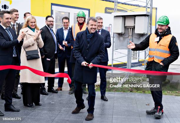 Crown Prince Frederik of Denmark cuts the ribbon for the inauguration of Aalborg Portland's pilot plant for CO2 capture, next to EU Energy...