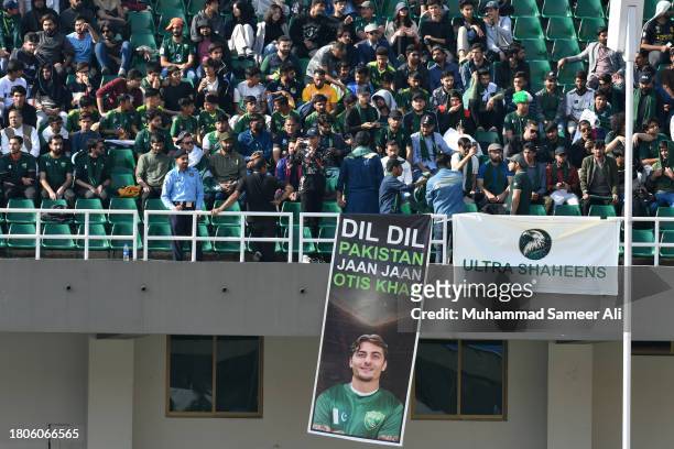 Fan's supporting Otis Khan from Pakistan hold banners during the 2026 FIFA World Cup AFC Qualifier Group G match between Pakistan and Tajikistan at...