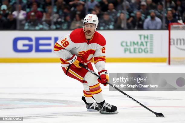 Dillon Dube of the Calgary Flames skates against the Seattle Kraken during the first period at Climate Pledge Arena on November 20, 2023 in Seattle,...