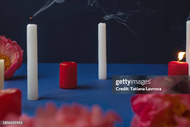 festive background with burning candles and flowers. valentines day, christmas, easter abstract composition with copy space - draft after party stock pictures, royalty-free photos & images