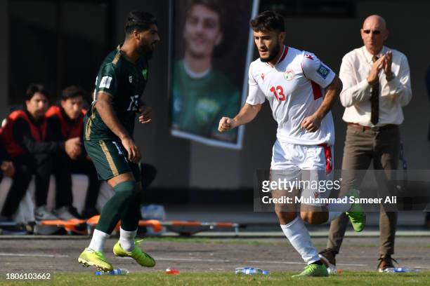 Junaid Ahmed Shah of Pakistan is encouraged by the coach Stephen Constantine in the background during the 2026 FIFA World Cup AFC Qualifier Group G...
