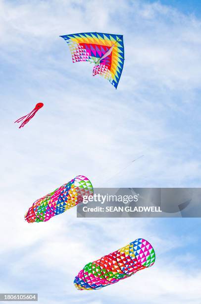 triangular and tubular kites - kite sky stock pictures, royalty-free photos & images