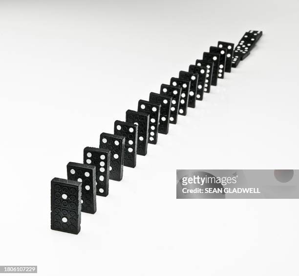 dominos arranged in line - network failure stock pictures, royalty-free photos & images