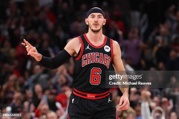 Alex Caruso of the Chicago Bulls celebrates a three pointer against the Phoenix Suns during the second half at the United Center on November 08, 2023...