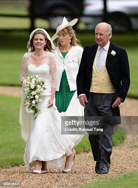 Lady Laura Marsham accompanied by her father Julian Marsham, Earl of Romney arrives for the wedding of James Meade and Lady Laura Marsham at The...